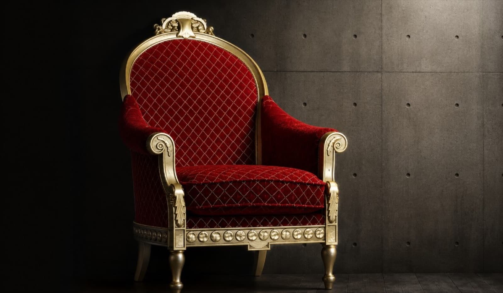 Ornate crimson quilted armchair with gilded carved frame