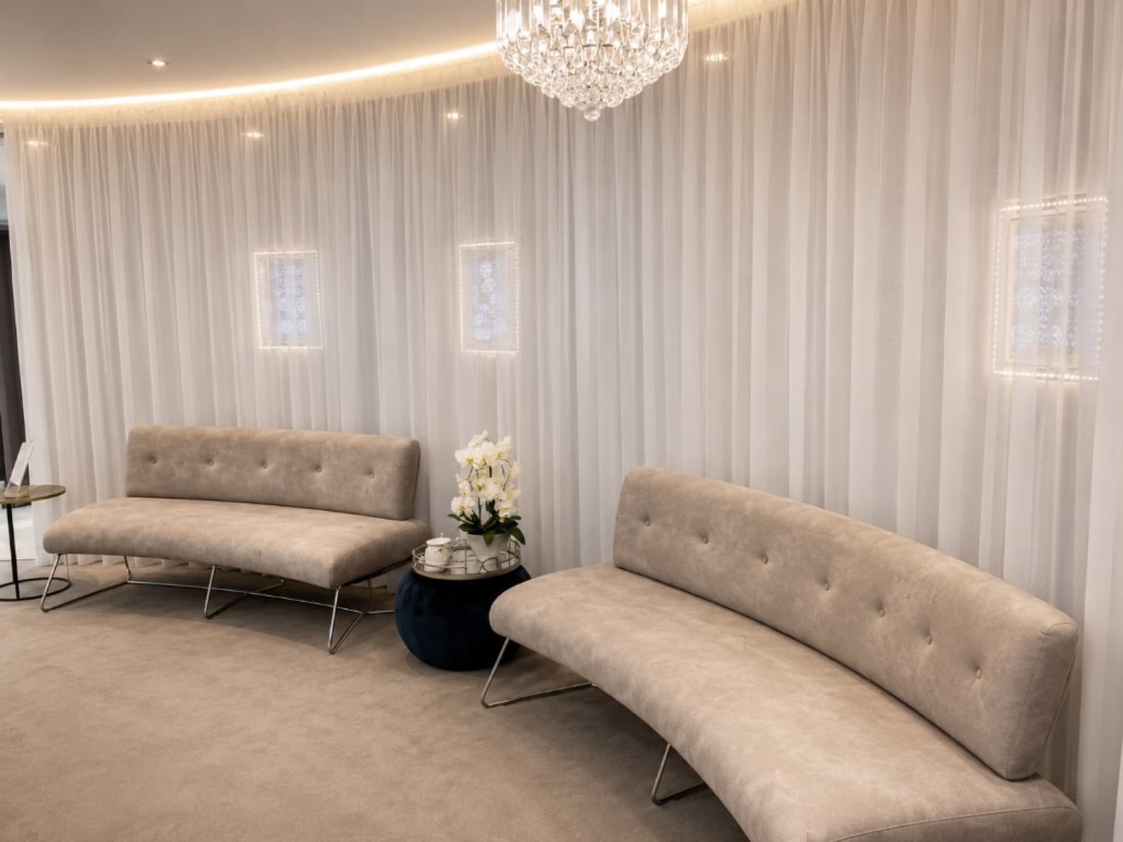 Custom curved beige commercial lounge seating with tufted backs