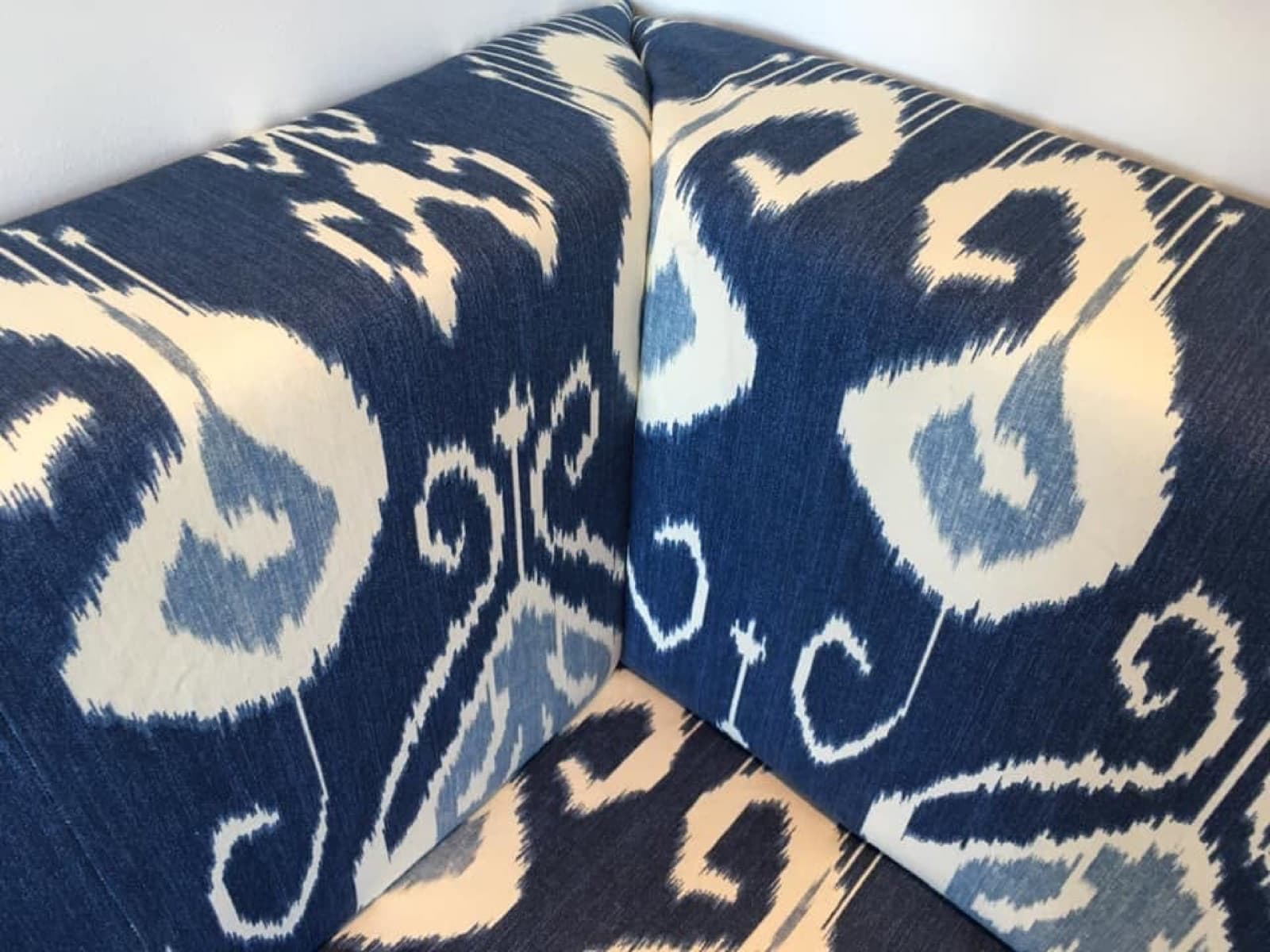 Blue and cream ikat patterned corner seating with carefully matched seams