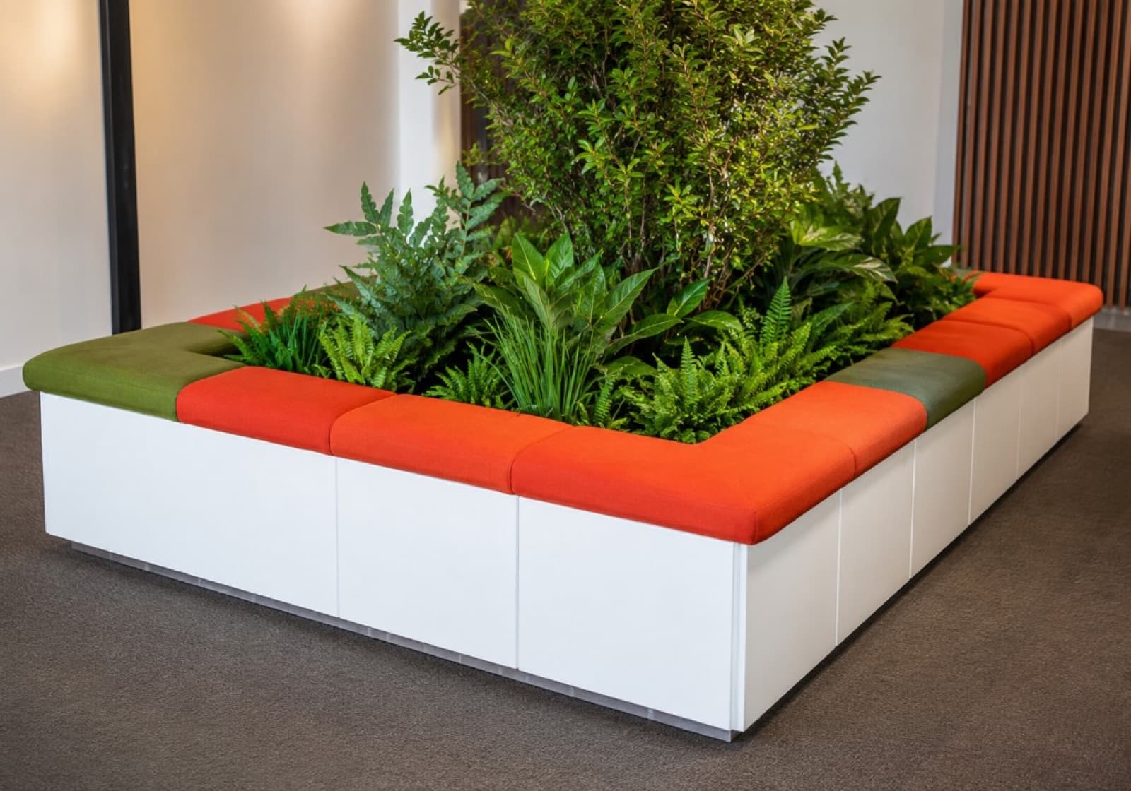 Commercial modular seating in orange and olive with integrated planter